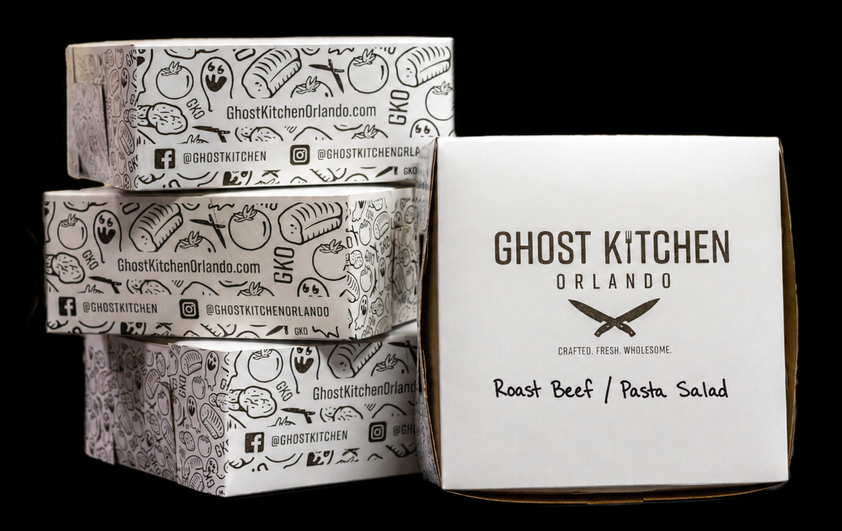 Stack of Ghost Kitchen Orlando boxed lunches with custom label reading Roast Beef / Pasta Salad